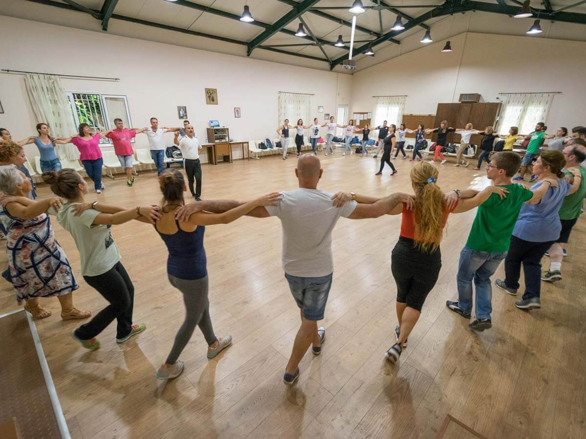 People learning Greek dances