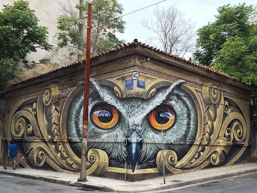 'Knowledge speaks - Wisdom listens' mural by street artist WD